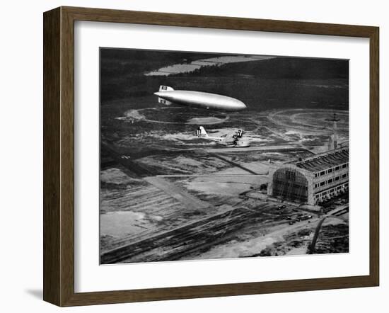 Hindenburg's Arrival with an Escort Plane over Lakehurst, New Jersey-null-Framed Photo