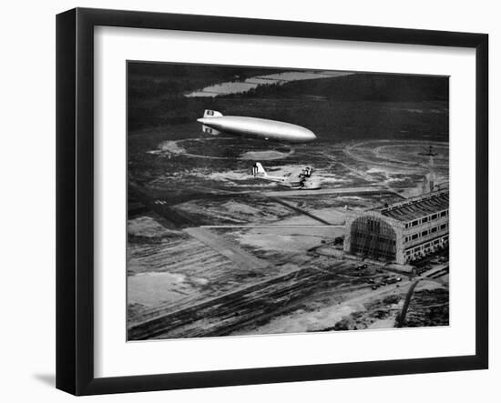Hindenburg's Arrival with an Escort Plane over Lakehurst, New Jersey-null-Framed Photo