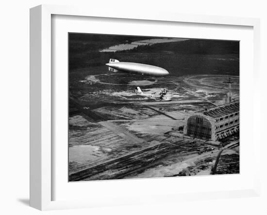 Hindenburg's Arrival with an Escort Plane over Lakehurst, New Jersey-null-Framed Photo