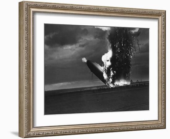 Hindenburg Zeppelin Bursting into Flames While Attempting to Land after 37th Ocean Crossing-Arthur Cofod-Framed Photographic Print