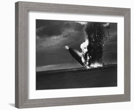 Hindenburg Zeppelin Bursting into Flames While Attempting to Land after 37th Ocean Crossing-Arthur Cofod-Framed Photographic Print