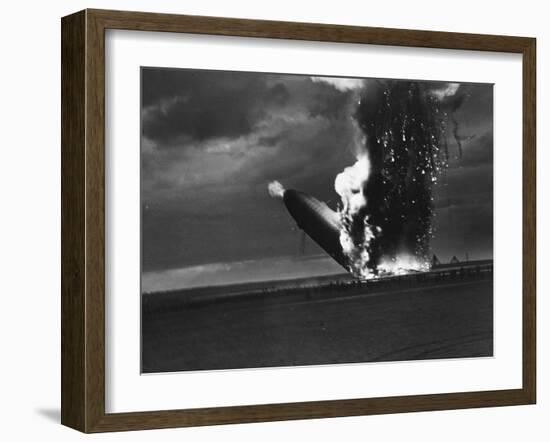 Hindenburg Zeppelin Bursting into Flames While Attempting to Land after 37th Ocean Crossing-Arthur Cofod-Framed Photographic Print