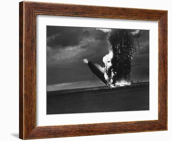 Hindenburg Zeppelin Bursting into Flames While Attempting to Land after 37th Ocean Crossing-Arthur Cofod-Framed Photographic Print