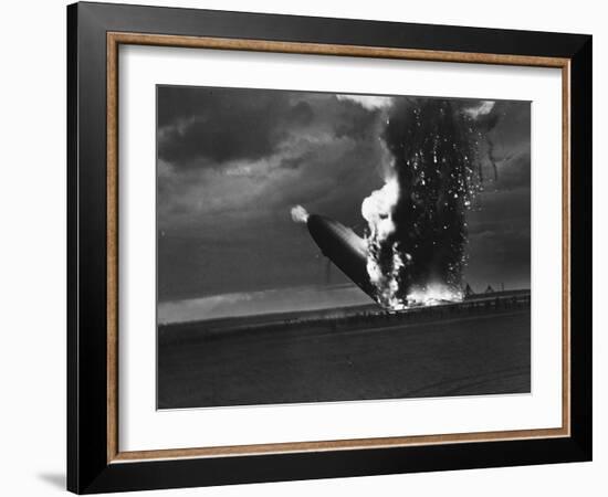 Hindenburg Zeppelin Bursting into Flames While Attempting to Land after 37th Ocean Crossing-Arthur Cofod-Framed Photographic Print