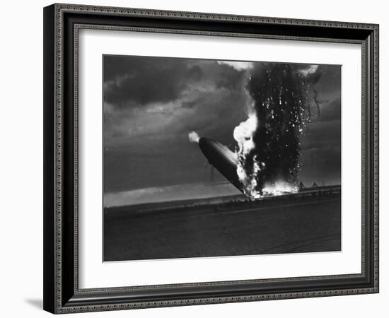 Hindenburg Zeppelin Bursting into Flames While Attempting to Land after 37th Ocean Crossing-Arthur Cofod-Framed Photographic Print