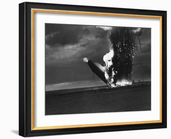 Hindenburg Zeppelin Bursting into Flames While Attempting to Land after 37th Ocean Crossing-Arthur Cofod-Framed Photographic Print