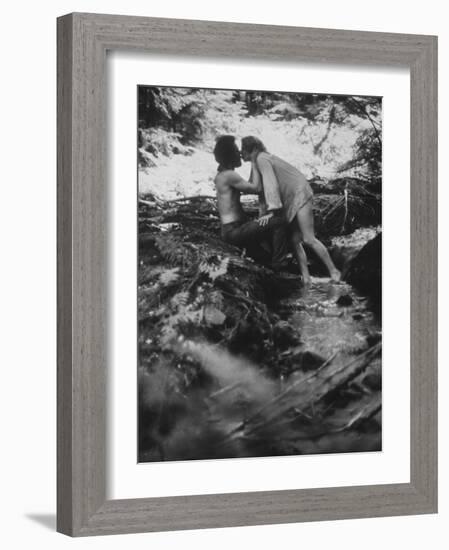 Hippie Couple Kissing at Woodstock Music Festival-Bill Eppridge-Framed Photographic Print