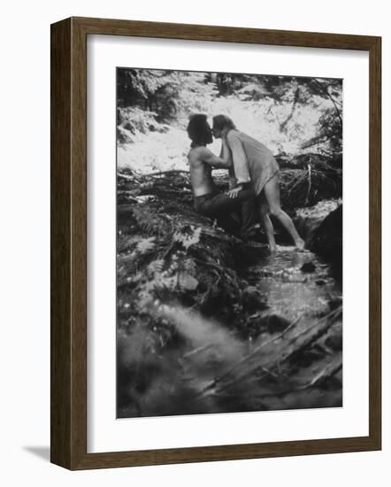 Hippie Couple Kissing at Woodstock Music Festival-Bill Eppridge-Framed Photographic Print