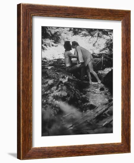 Hippie Couple Kissing at Woodstock Music Festival-Bill Eppridge-Framed Photographic Print