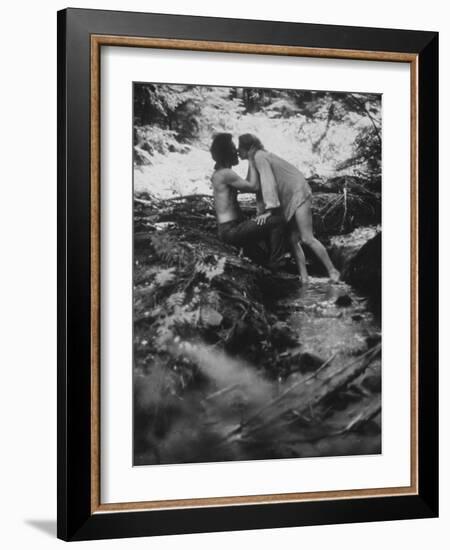 Hippie Couple Kissing at Woodstock Music Festival-Bill Eppridge-Framed Photographic Print