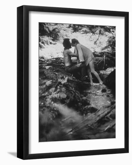 Hippie Couple Kissing at Woodstock Music Festival-Bill Eppridge-Framed Photographic Print