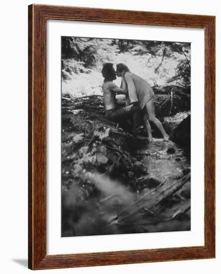 Hippie Couple Kissing at Woodstock Music Festival-Bill Eppridge-Framed Photographic Print