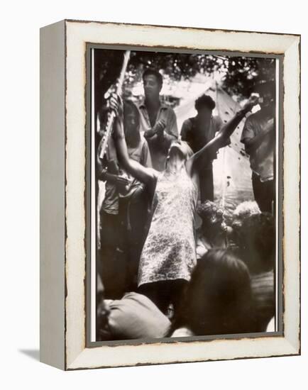 Hippie Girl Enthusiastically Playing Flute and Dancing at Woodstock Music Festival-null-Framed Premier Image Canvas