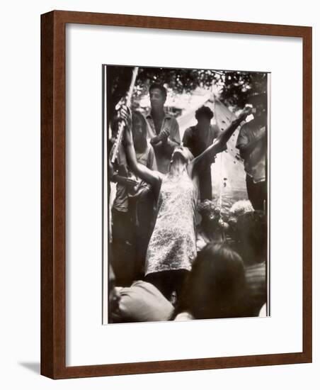 Hippie Girl Enthusiastically Playing Flute and Dancing at Woodstock Music Festival-null-Framed Photographic Print
