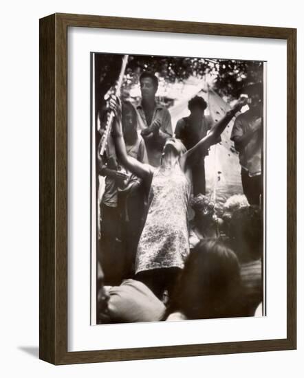 Hippie Girl Enthusiastically Playing Flute and Dancing at Woodstock Music Festival-null-Framed Photographic Print