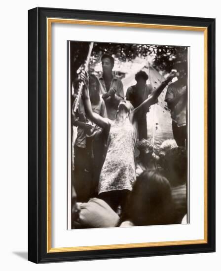 Hippie Girl Enthusiastically Playing Flute and Dancing at Woodstock Music Festival-null-Framed Photographic Print