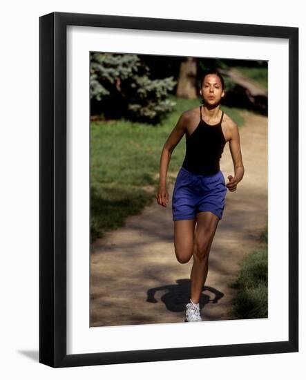 Hispanic Woman Running for Exercise-null-Framed Photographic Print