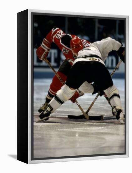 Hockey Players in Head to Head Competition-null-Framed Premier Image Canvas