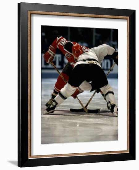 Hockey Players in Head to Head Competition-null-Framed Photographic Print