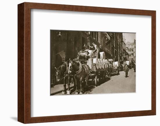 Hoisting the paper into a newspaper office, 20th century-Unknown-Framed Photographic Print