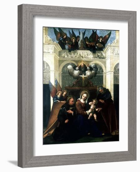 Holy Family with Saint Nicholas of Tolentino, 1515-1530-Lodovico Mazzolini-Framed Giclee Print