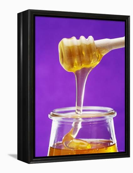 Honey Running from a Honey Dipper into a Jar-Marc O^ Finley-Framed Premier Image Canvas