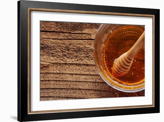 Honey Spoon In A Glass Jar Of Honey-Shea Evans-Framed Photographic Print