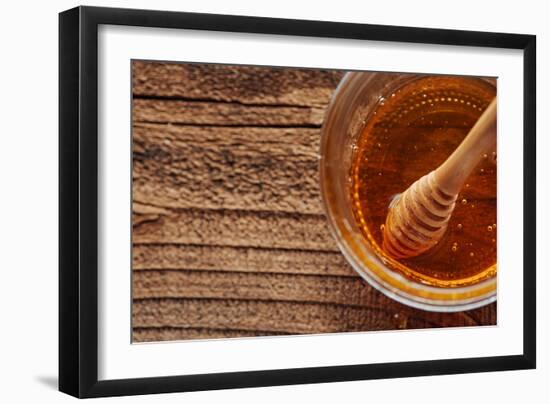 Honey Spoon In A Glass Jar Of Honey-Shea Evans-Framed Photographic Print