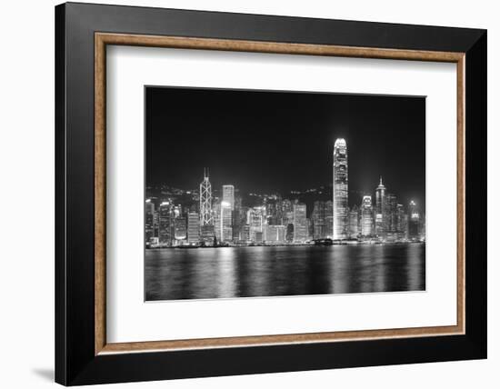 Hong Kong City Skyline at Night over Victoria Harbor with Clear Sky and Urban Skyscrapers.-Songquan Deng-Framed Photographic Print