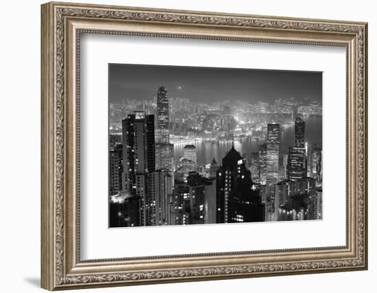 Hong Kong City Skyline at Night with Victoria Harbor and Skyscrapers Illuminated by Lights over Wat-Songquan Deng-Framed Photographic Print