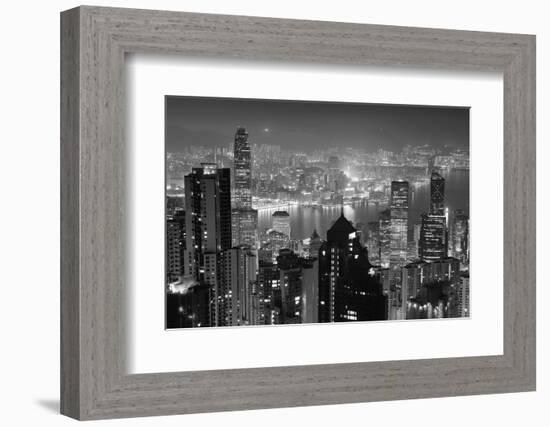 Hong Kong City Skyline at Night with Victoria Harbor and Skyscrapers Illuminated by Lights over Wat-Songquan Deng-Framed Photographic Print