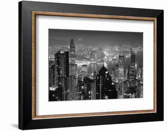 Hong Kong City Skyline at Night with Victoria Harbor and Skyscrapers Illuminated by Lights over Wat-Songquan Deng-Framed Photographic Print