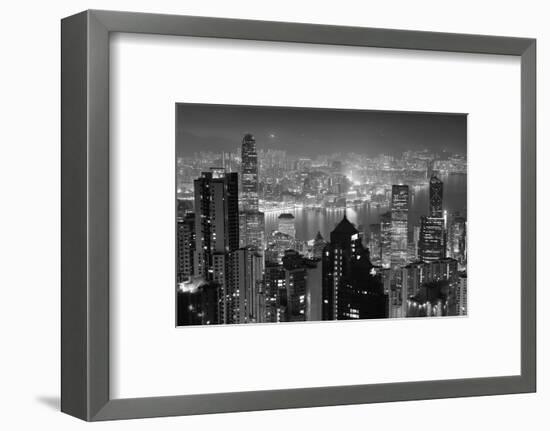 Hong Kong City Skyline at Night with Victoria Harbor and Skyscrapers Illuminated by Lights over Wat-Songquan Deng-Framed Photographic Print