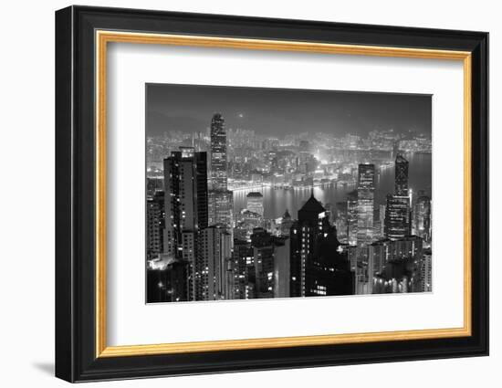 Hong Kong City Skyline at Night with Victoria Harbor and Skyscrapers Illuminated by Lights over Wat-Songquan Deng-Framed Photographic Print