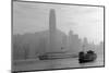 Hong Kong Skyline with Boats in Victoria Harbor in Black and White.-Songquan Deng-Mounted Photographic Print