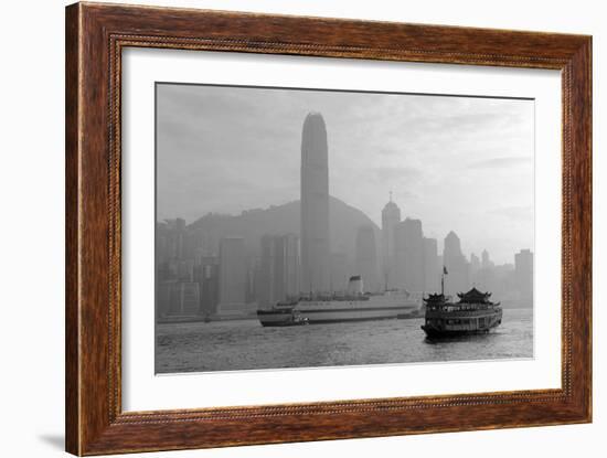 Hong Kong Skyline with Boats in Victoria Harbor in Black and White.-Songquan Deng-Framed Photographic Print