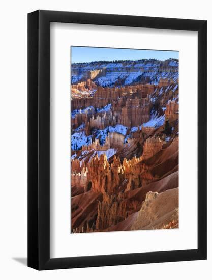 Hoodoos and Snowy Rim Cliffs Lit by Strong Late Afternoon Sun in Winter-Eleanor-Framed Photographic Print