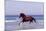 Horse Trotting Through Waves in Sea-null-Mounted Photographic Print