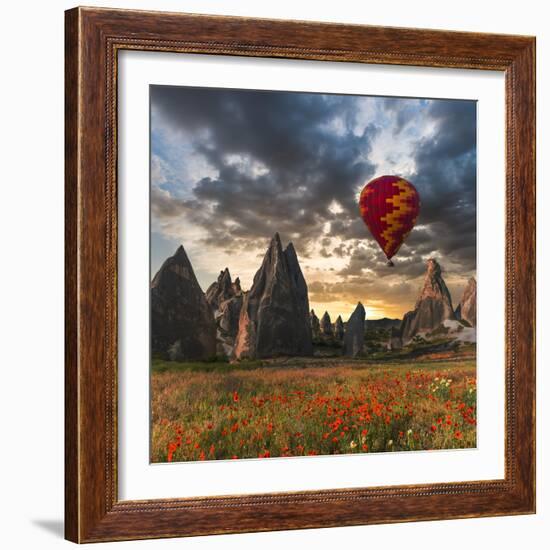 Hot Air Balloon Flying over Red Poppies Field Cappadocia Region, Turkey-Tetyana Kochneva-Framed Photographic Print