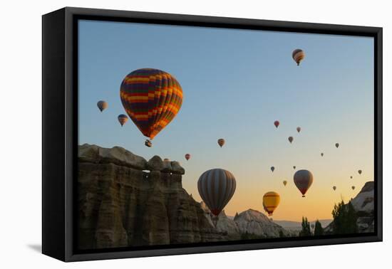 Hot Air Balloons Cruising over Cappadocia, Anatolia, Turkey, Asia Minor, Eurasia-James Strachan-Framed Premier Image Canvas