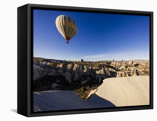 Hot Air Balloons Flying Among Rock Formations at Sunrise in the Red Valley-Ben Pipe-Framed Premier Image Canvas