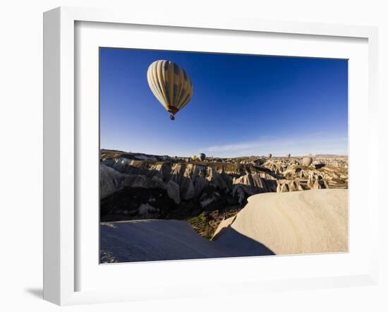 Hot Air Balloons Flying Among Rock Formations at Sunrise in the Red Valley-Ben Pipe-Framed Photographic Print