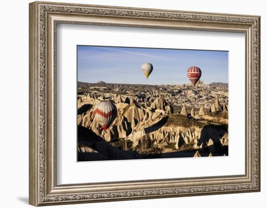 Hot Air Balloons Flying Among Rock Formations at Sunrise in the Red Valley-Ben Pipe-Framed Photographic Print