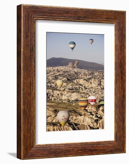 Hot Air Balloons Flying Among Rock Formations at Sunrise in the Red Valley-Ben Pipe-Framed Photographic Print