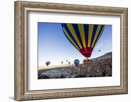 Hot Air Balloons Flying Among Rock Formations at Sunrise in the Red Valley-Ben Pipe-Framed Photographic Print