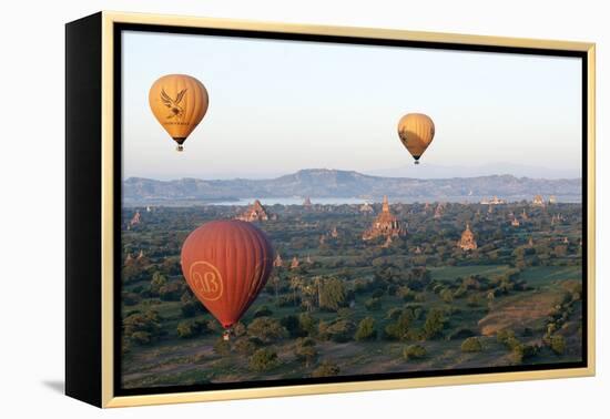 Hot Air Balloons Flying over the Terracotta Temples of Bagan-Annie Owen-Framed Premier Image Canvas
