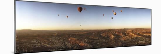 Hot Air Balloons over Landscape at Sunrise, Cappadocia, Central Anatolia Region, Turkey-null-Mounted Photographic Print