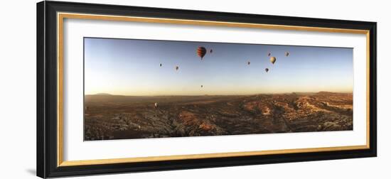 Hot Air Balloons over Landscape at Sunrise, Cappadocia, Central Anatolia Region, Turkey-null-Framed Photographic Print