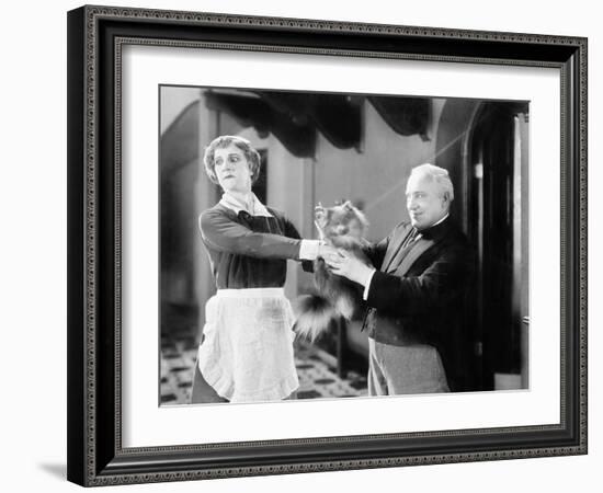 Housekeeper is Pushing a Puppy Away-null-Framed Photo