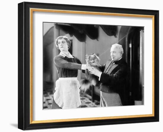 Housekeeper is Pushing a Puppy Away-null-Framed Photo
